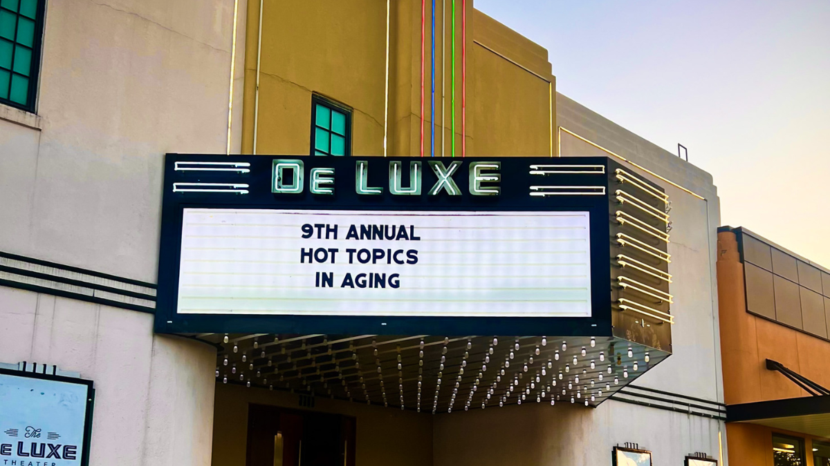 Marquee in front of the DeLuxe Theater stating 9th Hot Topics in Aging