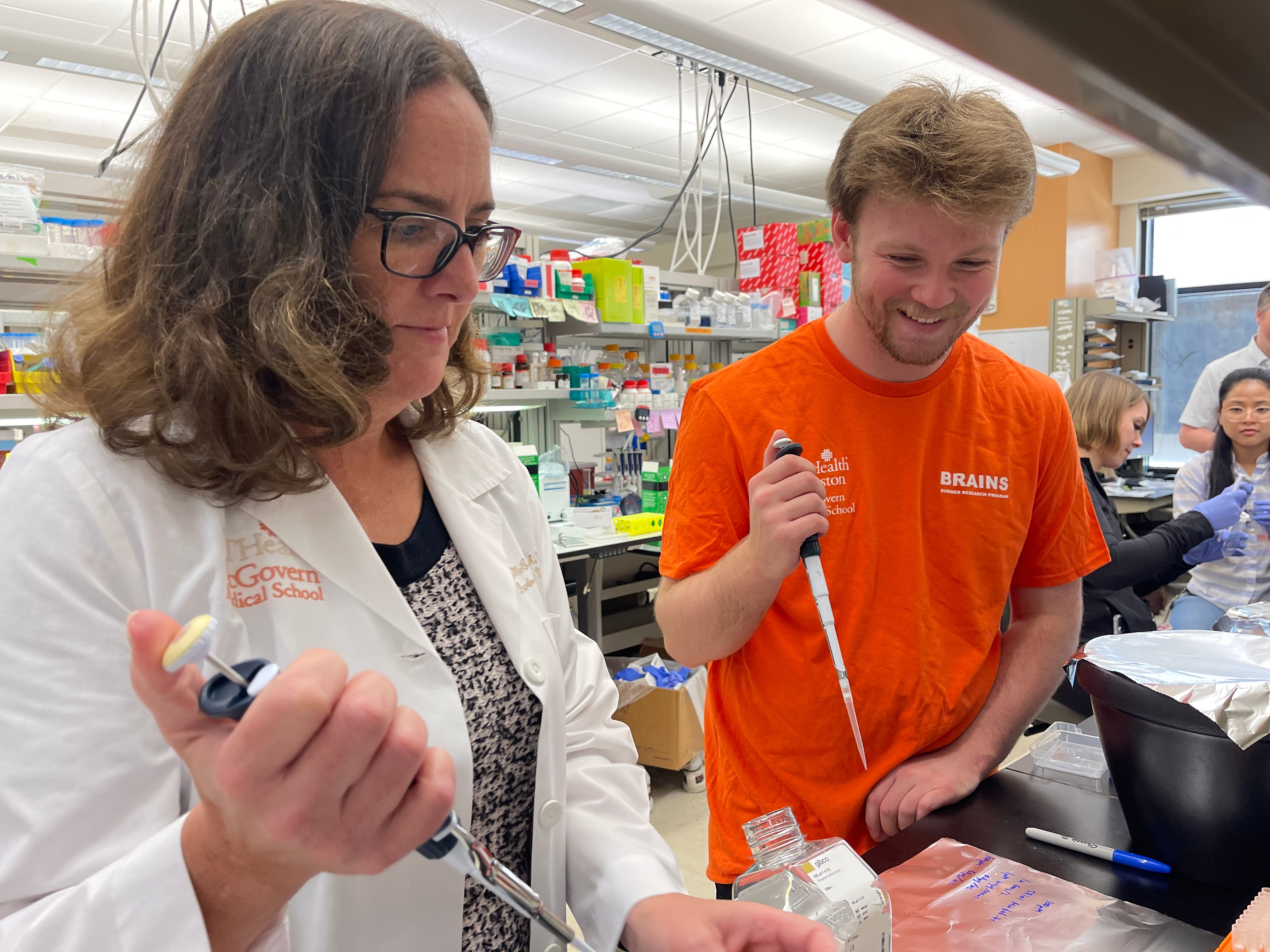 Jack Monday, 19, (right) spent his third summer in the BRAINS research laboratory with Louise McCullough, MD, PhD, (left) professor and co-director of the Department of Neurology with McGovern Medical School at UTHealth Houston.