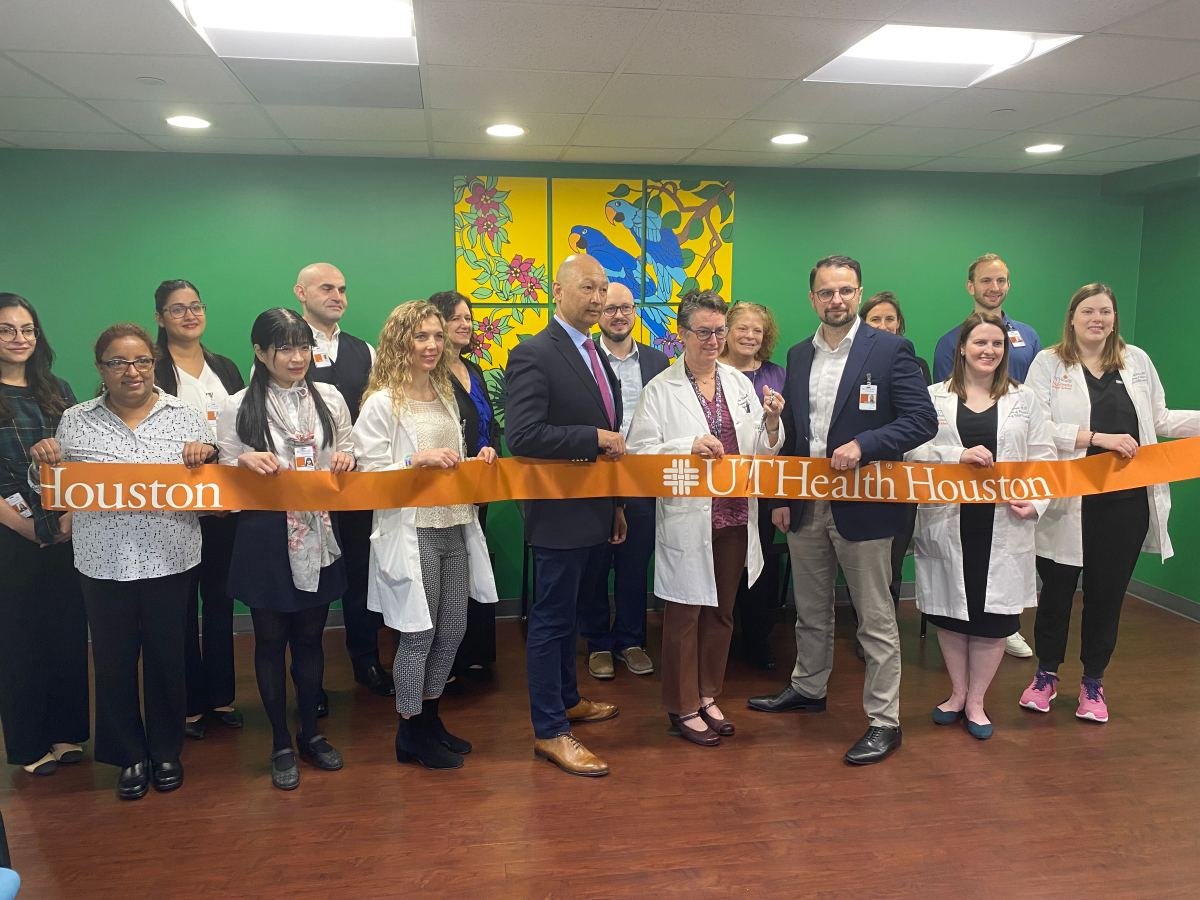 Members of the FamilieSCN2A Foundation join UTHealth Houston physicians for a ribbon-cutting ceremony in honor of the new center. (Photo by Caitie Barkley/UTHealth Houston)