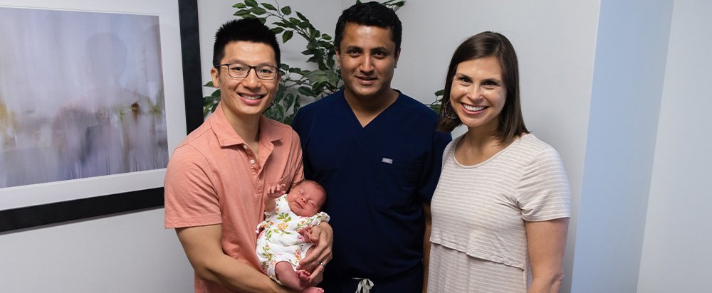 Anne and Mark Briggs with their newborn baby and Dr. Ramesha Papanna. Photo by Anne Briggs