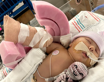At just 2 weeks old, Isabella Halligan underwent surgery, with a tourniquet placed under her shoulder to lower risk of future arm amputation. (Photo courtesy of Claudia Salas Melchor)