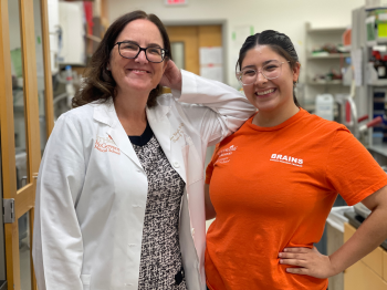 Jennifer Mendoza, 22, (right) learned more from Louise McCullough, MD, (left) about the science behind strokes and Alzheimer's disease in her summer internship at the BRAINS research laboratory. (Photo by UTHealth Houston)