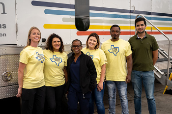 INTEGRA team pictured with patient, Frank Williams (second from the right) in front of the mobile unit. (Photo by UTHealth Houston)
