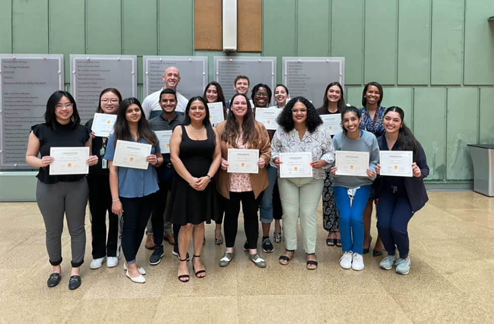 Group of participants posing with certificates after completing a leadership or development program.